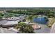 Aerial view of the community center with a pond and fountain on a sunny day at 1508 W Del Webb Blvd, Sun City Center, FL 33573