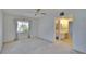 Spacious bedroom featuring a ceiling fan and an ensuite bathroom entrance with makeup counter at 1508 W Del Webb Blvd, Sun City Center, FL 33573