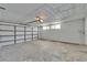 Spacious garage with updated flooring and plenty of room for storage at 1508 W Del Webb Blvd, Sun City Center, FL 33573