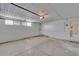 This garage is equipped with a garage door opener, a window, and lighting at 1508 W Del Webb Blvd, Sun City Center, FL 33573