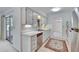 Functional kitchen features white cabinets, stainless steel appliances, and a decorative rug at 1508 W Del Webb Blvd, Sun City Center, FL 33573