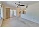 Open-plan living room featuring decorative room divider and sliding doors leading to the lanai at 1508 W Del Webb Blvd, Sun City Center, FL 33573