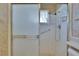 Updated bathroom shower features a grab bar at 1508 W Del Webb Blvd, Sun City Center, FL 33573