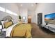 Bedroom with high ceilings, neutral carpet, and view of the Primary bath and walk-in closet, staged with bedroom set at 1924 E View Dr, Sun City Center, FL 33573