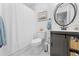 Bright bathroom with a hexagon tile floor, shiplap walls, and modern fixtures at 20354 Gamble Dr, Brooksville, FL 34601