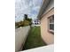 View of the fenced backyard featuring lush greenery and serene privacy for relaxation and outdoor enjoyment at 205 S Shore Crest Dr, Tampa, FL 33609