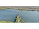 Panoramic aerial perspective highlights a scenic bridge surrounded by lush greenery and tranquil waters at 230 Lotus Dr, Safety Harbor, FL 34695