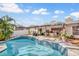 Inviting backyard with sparkling pool, covered patio and ample space for entertaining at 230 Lotus Dr, Safety Harbor, FL 34695