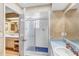 Bathroom with dual vanity, shower, and open doorway for easy access between rooms at 230 Lotus Dr, Safety Harbor, FL 34695