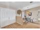 Inviting foyer with wood flooring and a formal dining area featuring a hanging chandelier at 230 Lotus Dr, Safety Harbor, FL 34695