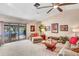 This comfortable living room features a sofa and access to the screened-in patio at 230 Lotus Dr, Safety Harbor, FL 34695