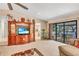 This open-plan living area has a view of the outdoor living space at 230 Lotus Dr, Safety Harbor, FL 34695