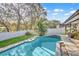 Beautiful pool area with mature trees, lush landscaping and a relaxing atmosphere at 230 Lotus Dr, Safety Harbor, FL 34695