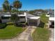 Overhead view of the property, highlighting the driveway and landscaping at 2610 Forest Run Ct, Clearwater, FL 33761