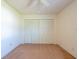 Bedroom featuring a ceiling fan and closet with bi-fold doors at 2610 Forest Run Ct, Clearwater, FL 33761