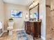 Well-appointed bathroom with a decorative vanity, modern toilet, and tiled shower at 2823 St Croix Dr, Clearwater, FL 33759