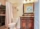 Charming bathroom with a carved vanity, large mirror, and tile shower with glass doors at 2823 St Croix Dr, Clearwater, FL 33759