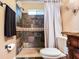 Bathroom offers a tiled shower with a built-in seat, glass doors, and unique fixtures at 2823 St Croix Dr, Clearwater, FL 33759