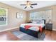 Cozy bedroom with wood floors, ceiling fan, and large windows for plenty of natural light at 2823 St Croix Dr, Clearwater, FL 33759