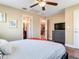 Spacious bedroom has a ceiling fan, wood floors, and a closet with a view into the bathroom at 2823 St Croix Dr, Clearwater, FL 33759