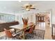 Open-concept dining area with ceiling fan and view to a living area and a grand front entrance at 2823 St Croix Dr, Clearwater, FL 33759