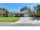 Inviting single-story home with a well-manicured lawn, covered porch, and attached garage at 2823 St Croix Dr, Clearwater, FL 33759