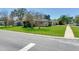 Charming single-story home with a green lawn, driveway, and view from the street at 2823 St Croix Dr, Clearwater, FL 33759