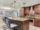 Kitchen features a granite countertop island with stone accents and stainless appliances at 2823 St Croix Dr, Clearwater, FL 33759
