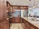 Kitchen features granite counters, stainless appliances, and custom cabinetry at 2823 St Croix Dr, Clearwater, FL 33759