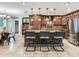 Stylish kitchen island featuring dark wood cabinetry, granite countertops, and barstool seating at 2823 St Croix Dr, Clearwater, FL 33759