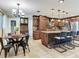 Spacious kitchen features an island with stone accents, stainless appliances, and breakfast nook table at 2823 St Croix Dr, Clearwater, FL 33759