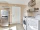 A spacious laundry room featuring modern appliances and shelving for storage at 2823 St Croix Dr, Clearwater, FL 33759