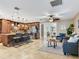 Spacious living room featuring tile floors, a stylish kitchen island, and ample seating at 2823 St Croix Dr, Clearwater, FL 33759