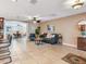 Spacious living room with tiled flooring and kitchen bar stool seating at 2823 St Croix Dr, Clearwater, FL 33759
