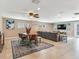 Open-concept living room featuring modern furnishings, a ceiling fan, and access to the outdoors at 2823 St Croix Dr, Clearwater, FL 33759