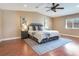 Tranquil main bedroom with a ceiling fan and hardwood floors and modern decor at 2823 St Croix Dr, Clearwater, FL 33759