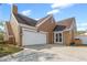 Exterior showcasing a well-maintained home with a two-car garage, manicured lawn, and inviting curb appeal at 2912 Spaniel Ln, Seffner, FL 33584