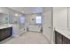 Modern bathroom with glass shower, soaking tub, and double vanity at 3020 Silva Wood Dr, Valrico, FL 33596