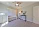 This bedroom features a stylish Murphy bed and a functional workspace with a sleek, modern desk at 3020 Silva Wood Dr, Valrico, FL 33596