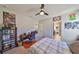 Bedroom with ceiling fan and dark wood furniture at 3020 Silva Wood Dr, Valrico, FL 33596