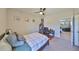 Cozy bedroom with ceiling fan and desk at 3020 Silva Wood Dr, Valrico, FL 33596
