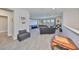 A large game room features a projector screen, comfortable seating, and plenty of space for entertainment at 3020 Silva Wood Dr, Valrico, FL 33596