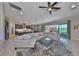 A spacious living room with a comfortable sectional sofa, stylish rug, and access to an outdoor living space at 3020 Silva Wood Dr, Valrico, FL 33596