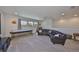 Living room featuring ample lighting and a pool table at 3020 Silva Wood Dr, Valrico, FL 33596