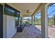 Covered patio with television, stainless steel grill, and view of the backyard at 3020 Silva Wood Dr, Valrico, FL 33596