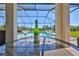 Wine bottle and glasses on a table overlooking the pool and backyard at 3020 Silva Wood Dr, Valrico, FL 33596
