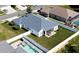 Aerial view of a home with a fenced yard and swimming pool at 3215 Coconut Grove Rd, Land O Lakes, FL 34639