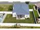Aerial view of a home with a fenced yard and patio with screen enclosure at 3215 Coconut Grove Rd, Land O Lakes, FL 34639