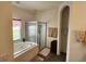Relaxing bathroom with a soaking tub, glass shower, and tiled floor at 3215 Coconut Grove Rd, Land O Lakes, FL 34639