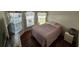 Cozy bedroom featuring a comfortable bed, natural light, and a relaxing ambiance at 3215 Coconut Grove Rd, Land O Lakes, FL 34639